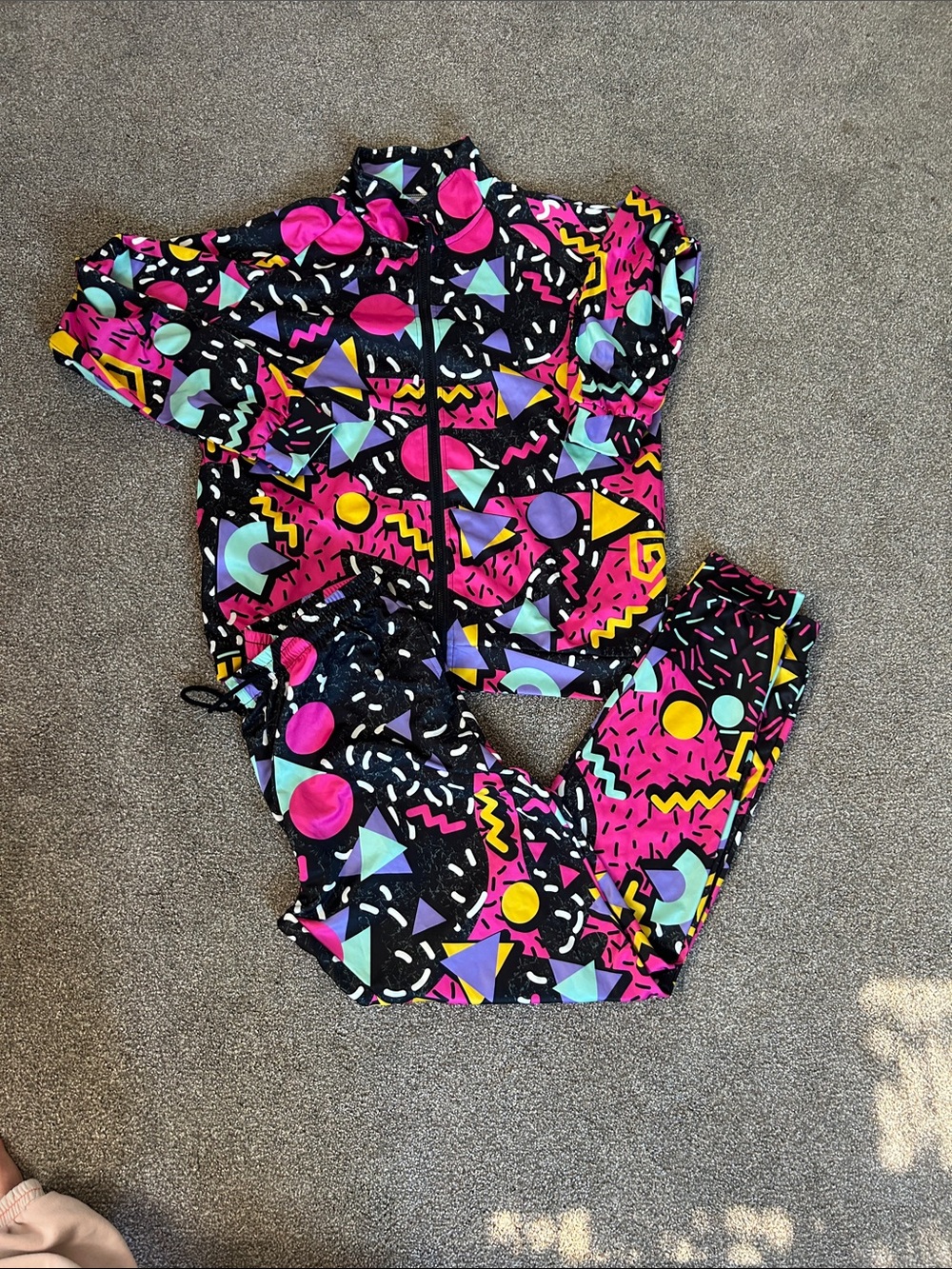 Men's 80’s Costume Black & Pink Geometric Pattern Footie Jumpsuit
